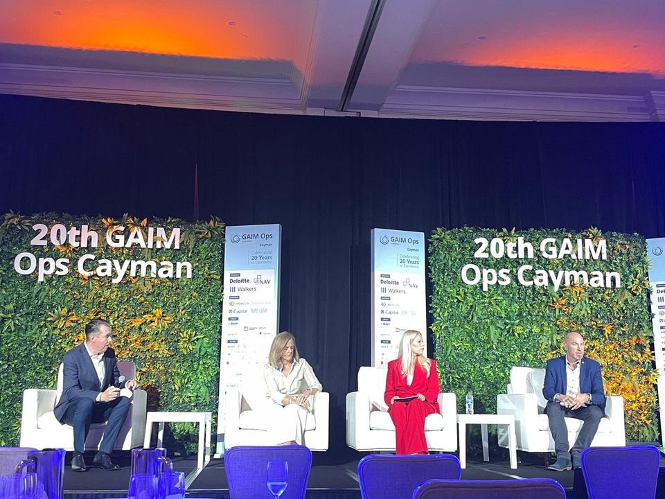Panel discussion on stage at the 20th GAIM Ops Cayman conference